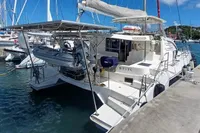 2018 Leopard 48 yacht docked at marina with dinghy and solar panels.