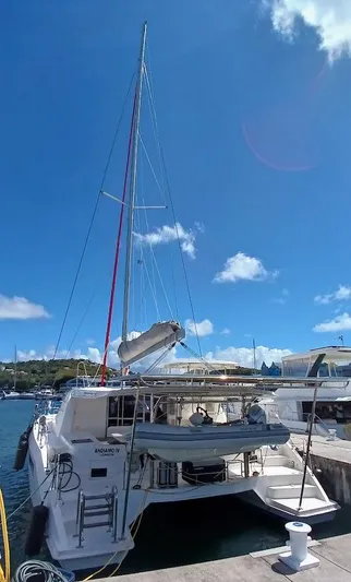Andiamo IV Yacht Photos Pics 2018 Leopard 48 catamaran docked under clear blue sky.