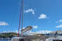 2018 Leopard 48 catamaran docked under clear blue sky.