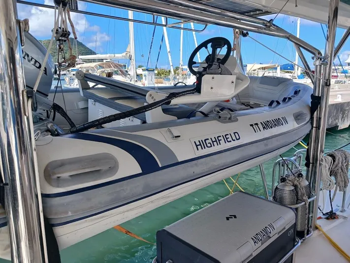 Andiamo IV Yacht Photos Pics Inflatable boat on Leopard 48 yacht, 2018 model, docked at marina with clear skies.