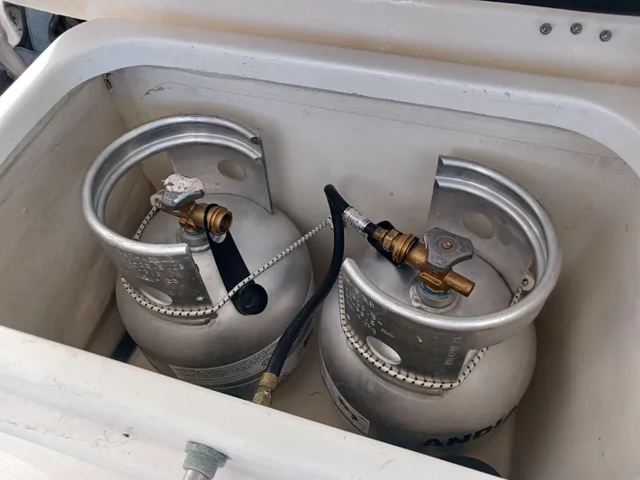 Andiamo IV Yacht Photos Pics Two propane tanks in a storage compartment on a 2018 Leopard 48 yacht.