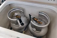 Two propane tanks in a storage compartment on a 2018 Leopard 48 yacht.