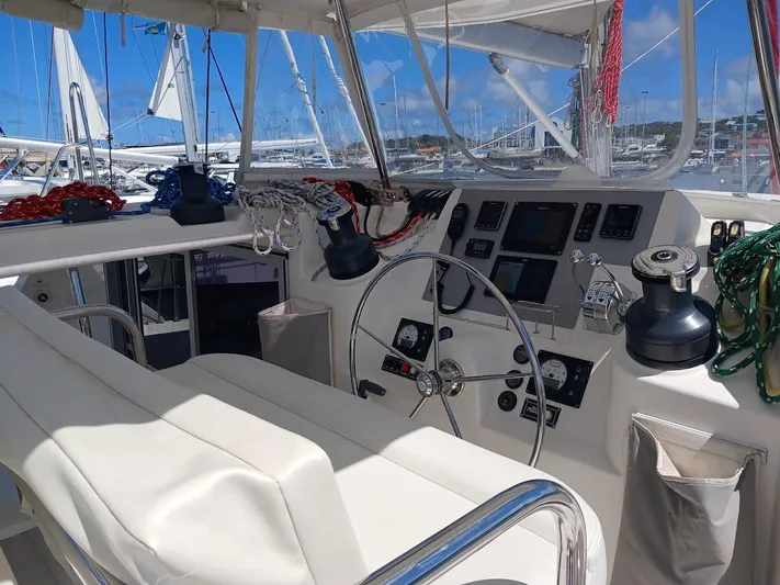 Andiamo IV Yacht Photos Pics Cockpit of 2018 Leopard 48 yacht with steering wheel and navigation instruments.