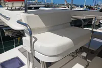 White cushioned seating on 2018 Leopard 48 yacht, docked in marina.