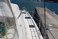 Leopard 48 yacht docked at marina, clear skies, 2018 model.