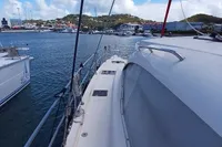 Leopard 48 yacht docked in scenic marina, clear skies, 2018 model.