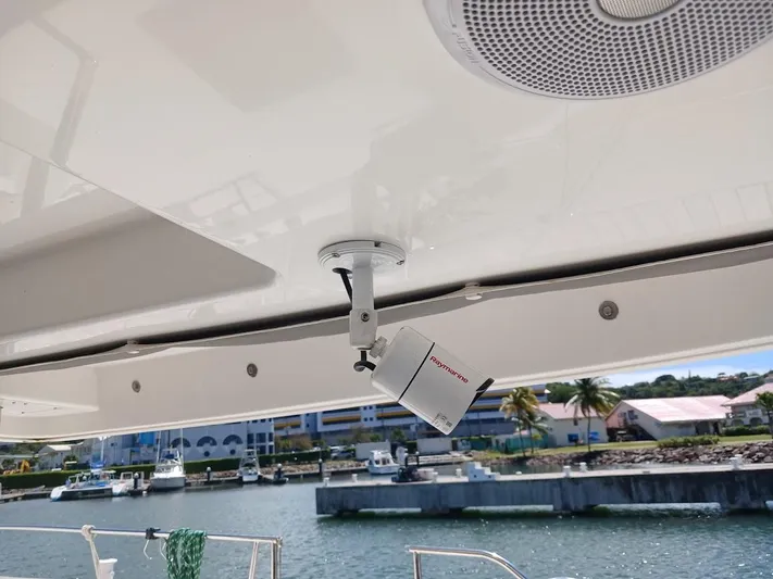 Andiamo IV Yacht Photos Pics Security camera on a 2018 Leopard 48 yacht, overlooking a marina.