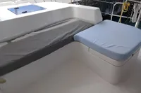 Leopard 48 yacht seating area, 2018 model, with cushioned benches and storage.