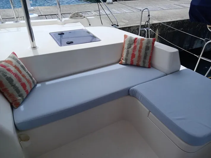Andiamo IV Yacht Photos Pics Comfortable seating area on a 2018 Leopard 48 yacht with cushions and pillows.
