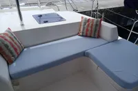 Comfortable seating area on a 2018 Leopard 48 yacht with cushions and pillows.