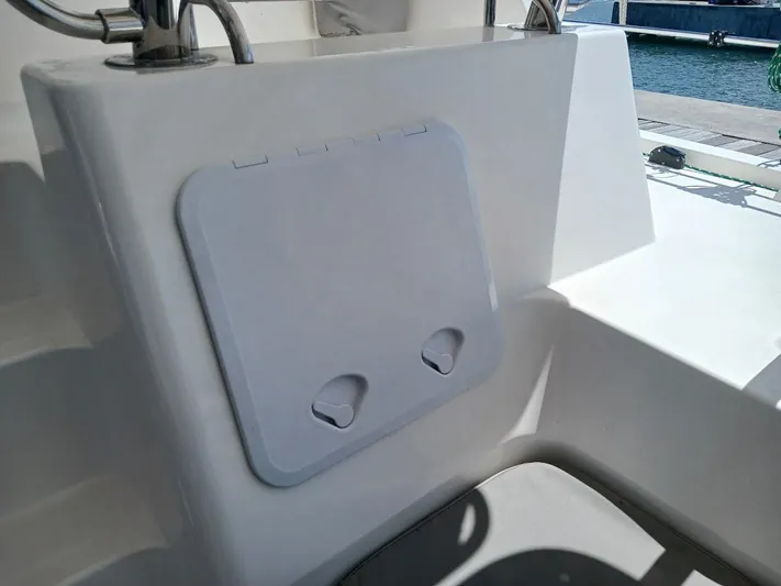 Andiamo IV Yacht Photos Pics Leopard 48 yacht deck with storage compartment, 2018 model, featuring sleek design and ocean view.