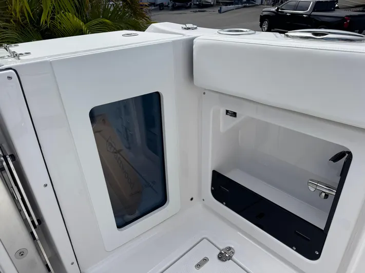  Yacht Photos Pics 2026 Blackfin 302 DC boat interior storage compartment with sleek white design.