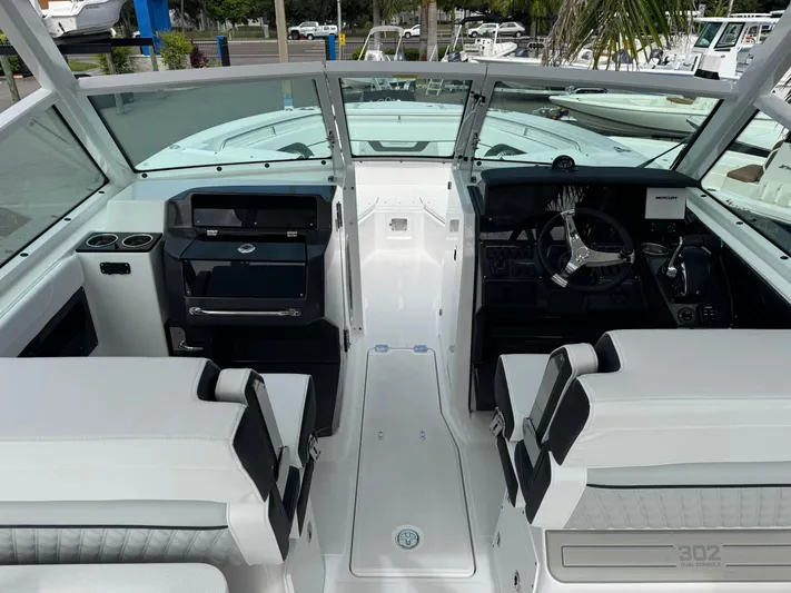  Yacht Photos Pics 2026 Blackfin 302 DC boat interior with modern helm and seating.