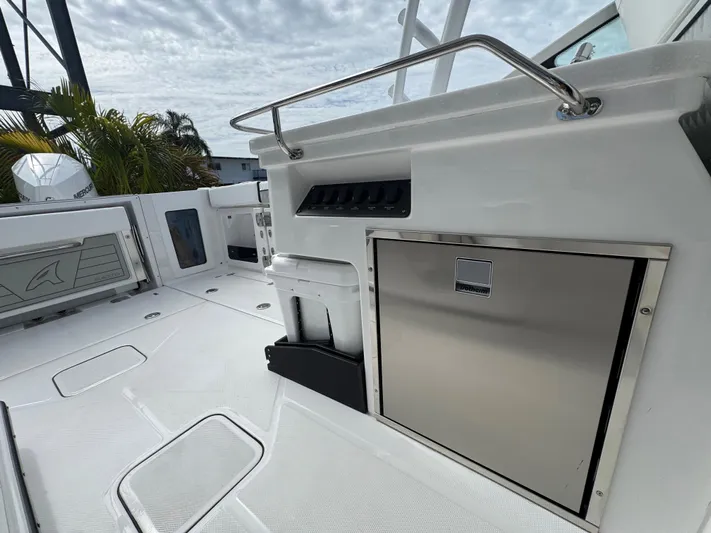  Yacht Photos Pics 2026 Blackfin 302 DC boat deck with stainless steel features and storage compartments.