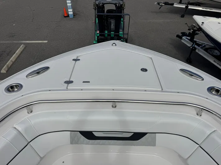  Yacht Photos Pics 2026 Blackfin 302 DC boat bow view in parking lot.