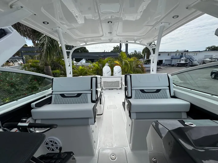  Yacht Photos Pics Interior view of 2026 Blackfin 302 DC boat with seating and modern design.