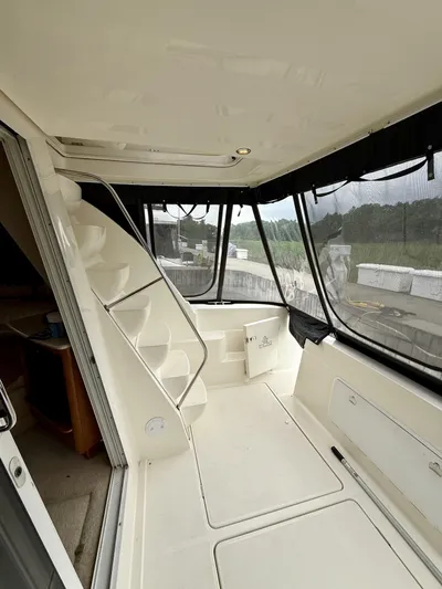  Yacht Photos Pics 2004 Meridian 381 Sedan interior with spiral staircase and panoramic windows.