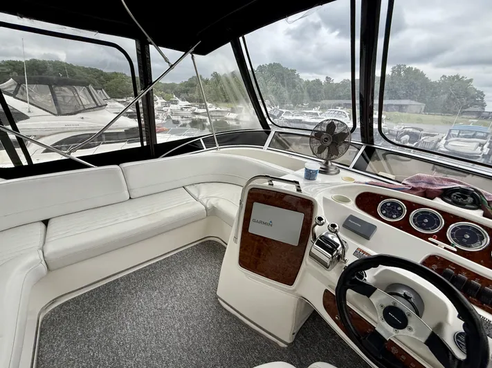  Yacht Photos Pics Interior of a 2004 Meridian 381 Sedan yacht with steering wheel and navigation equipment.