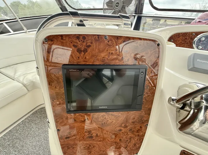  Yacht Photos Pics 2004 Meridian 381 Sedan dashboard with Garmin GPS and wood paneling.