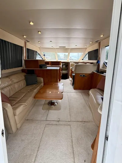  Yacht Photos Pics Luxurious interior of a 2004 Meridian 381 Sedan yacht with leather seating and wood accents.