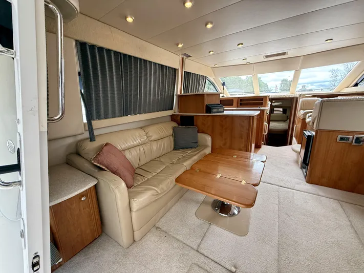  Yacht Photos Pics Luxurious interior of 2004 Meridian 381 Sedan yacht with leather seating and wooden accents.