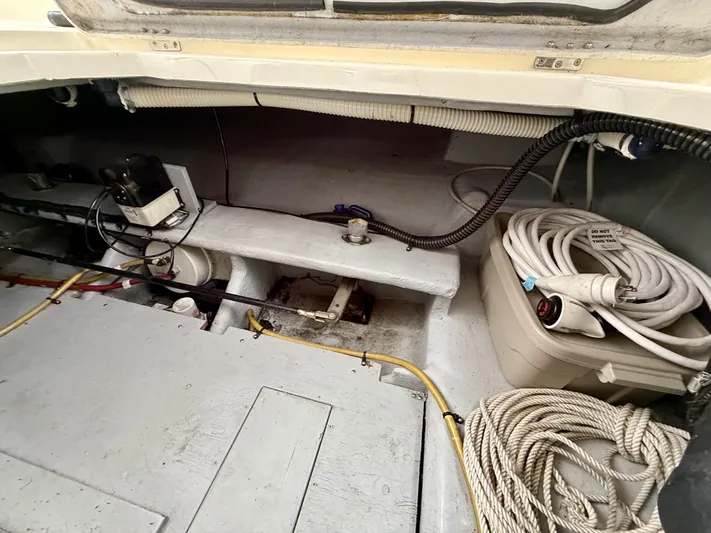  Yacht Photos Pics 2004 Meridian 381 Sedan engine compartment with cables and storage.