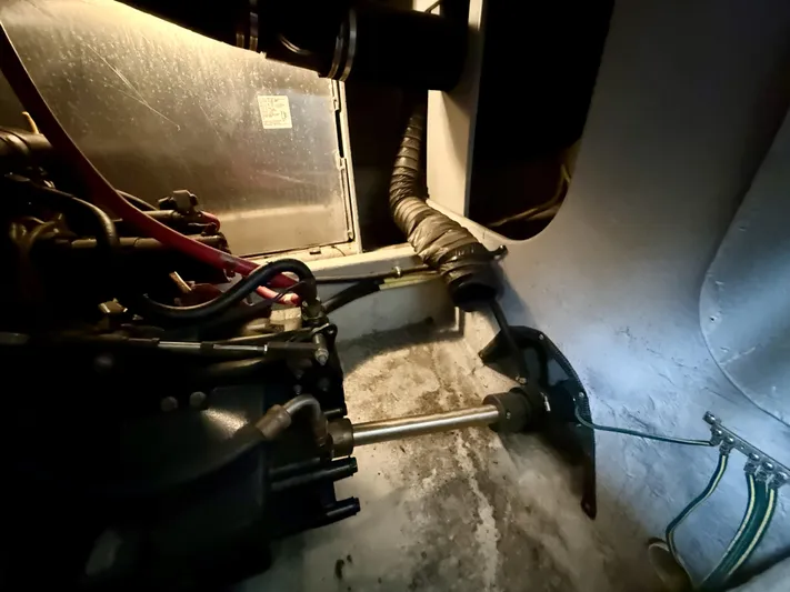  Yacht Photos Pics Engine compartment of a 2004 Meridian 381 Sedan boat, showing mechanical components and wiring.