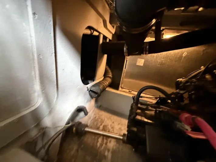  Yacht Photos Pics Engine room of a 2004 Meridian 381 Sedan, showcasing mechanical components and wiring.