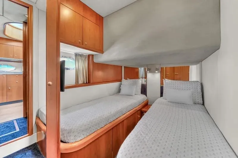  Yacht Photos Pics Twin cabin interior of 2006 Sunseeker Predator 72 yacht with wooden cabinetry.