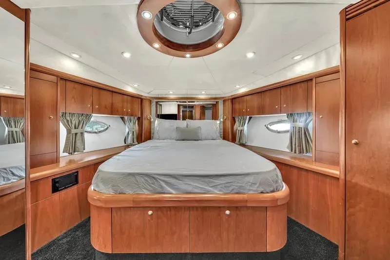  Yacht Photos Pics Luxurious cabin interior of 2006 Sunseeker Predator 72 yacht with elegant wood finish.