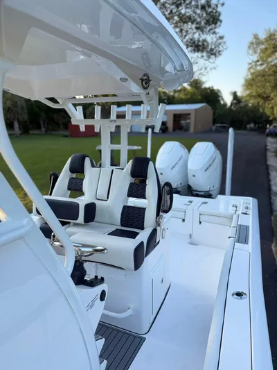  Yacht Photos Pics 2025 Tidewater 3100 Carolina Bay boat with dual engines and sleek seating.