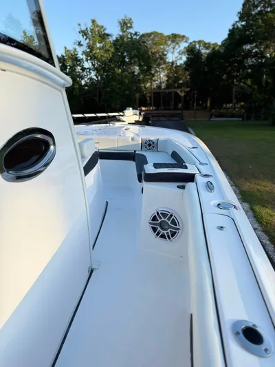  Yacht Photos Pics 2025 Tidewater 3100 Carolina Bay boat deck with seating and speakers.