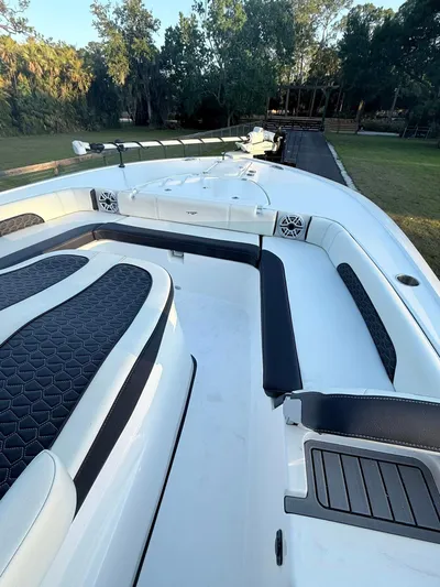  Yacht Photos Pics 2025 Tidewater 3100 Carolina Bay boat with sleek seating and modern design.