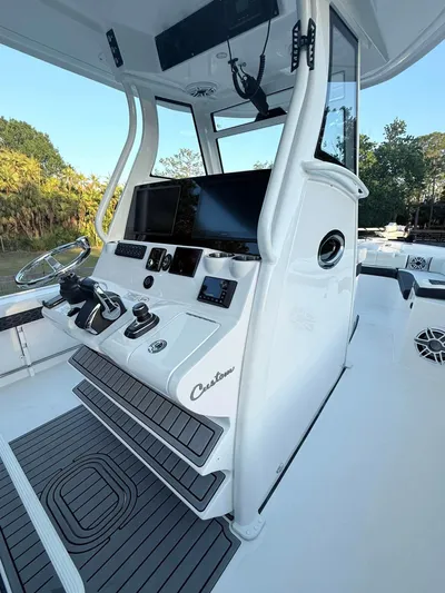  Yacht Photos Pics 2025 Tidewater 3100 Carolina Bay boat cockpit with advanced navigation controls and sleek design.