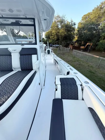  Yacht Photos Pics 2025 Tidewater 3100 Carolina Bay boat with sleek seating and modern design.