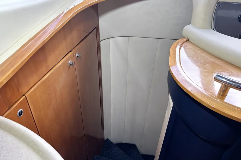  Yacht Photos Pics Interior of 2003 Azimut 55 yacht, featuring wooden cabinetry and elegant design.