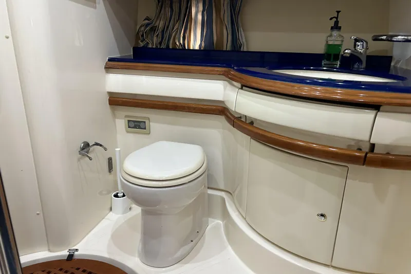  Yacht Photos Pics Luxurious bathroom in 2003 Azimut 55 yacht with modern fixtures and elegant design.