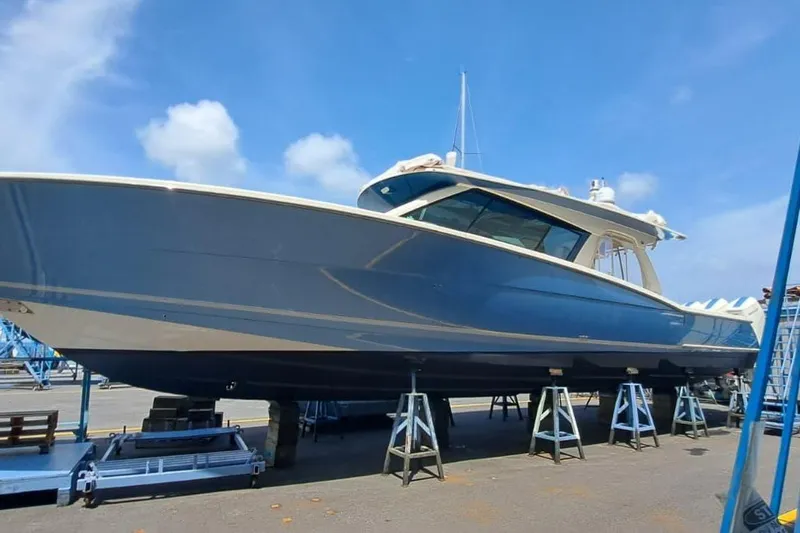  Yacht Photos Pics 2022 Scout 530 LXF boat on stands under a clear blue sky.