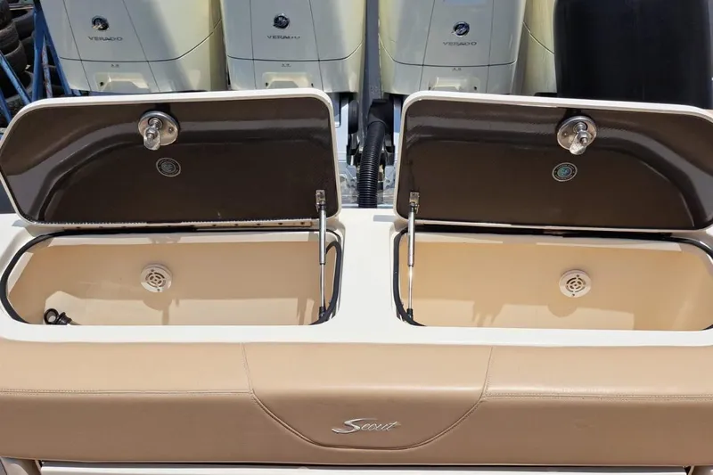  Yacht Photos Pics 2022 Scout 530 LXF boat with open storage compartments and Verado engines.