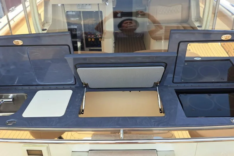  Yacht Photos Pics 2022 Scout 530 LXF yacht kitchen area with sink and storage compartments.