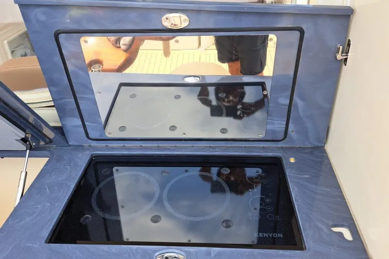  Yacht Photos Pics 2022 Scout 530 LXF boat with Kenyon electric cooktop in blue countertop.