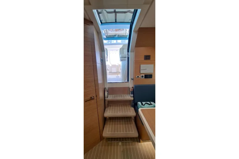  Yacht Photos Pics Interior view of 2022 Scout 530 LXF yacht with wooden stairs and modern design.