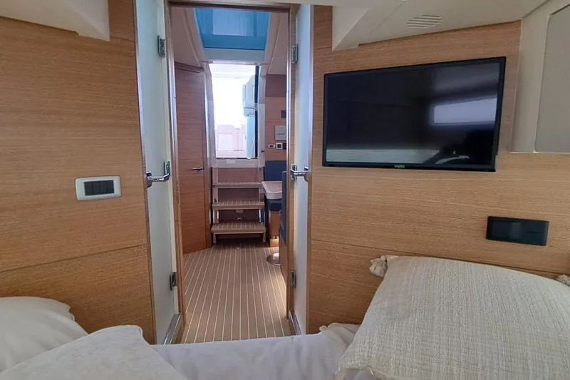  Yacht Photos Pics Interior of 2022 Scout 530 LXF yacht with modern wood finish and mounted TV.