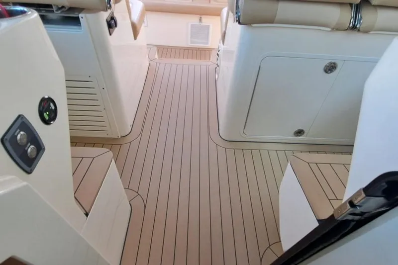  Yacht Photos Pics 2022 Scout 530 LXF interior with sleek, modern design and wood-patterned flooring.