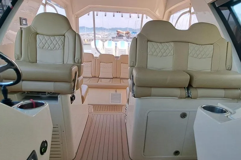  Yacht Photos Pics Interior of 2022 Scout 530 LXF boat with luxurious beige seating.