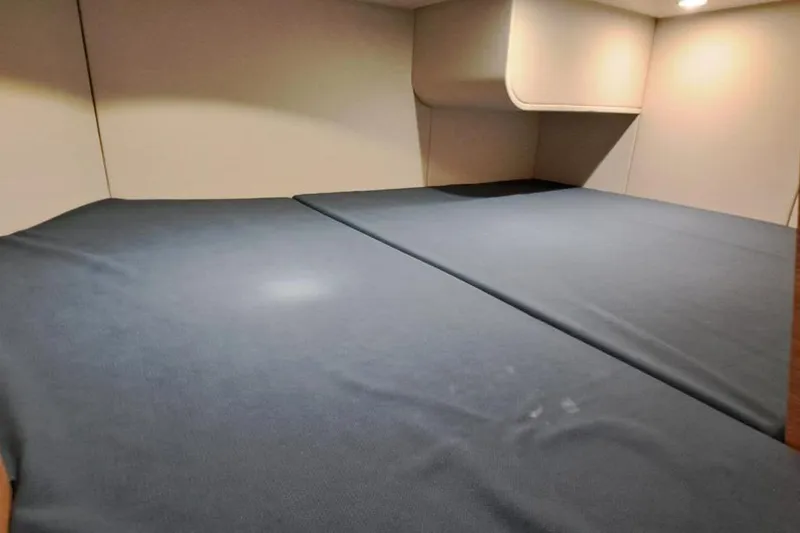  Yacht Photos Pics Interior cabin of 2022 Scout 530 LXF boat, featuring a spacious sleeping area.