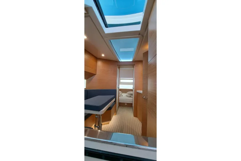  Yacht Photos Pics Interior of 2022 Scout 530 LXF yacht, featuring modern wood paneling and skylight.
