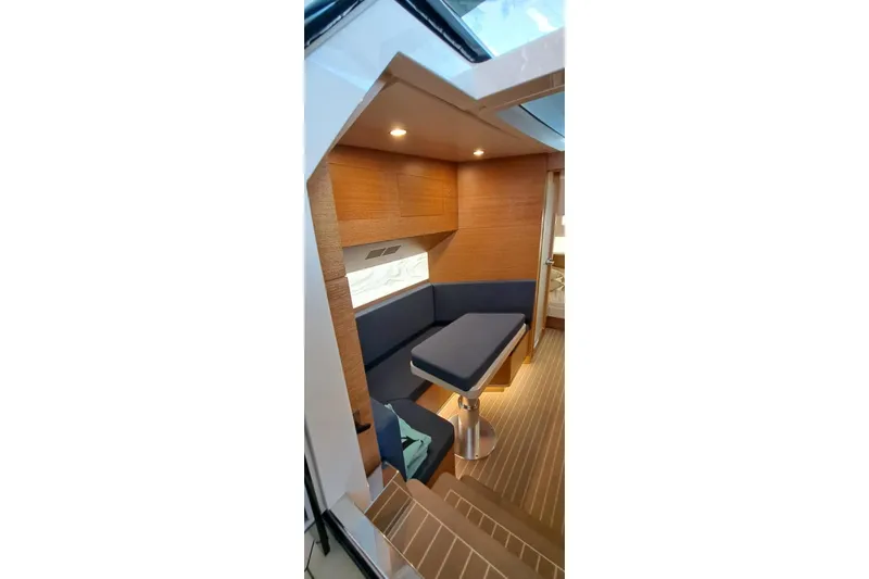  Yacht Photos Pics Luxurious interior of 2022 Scout 530 LXF yacht with modern seating and wood finish.