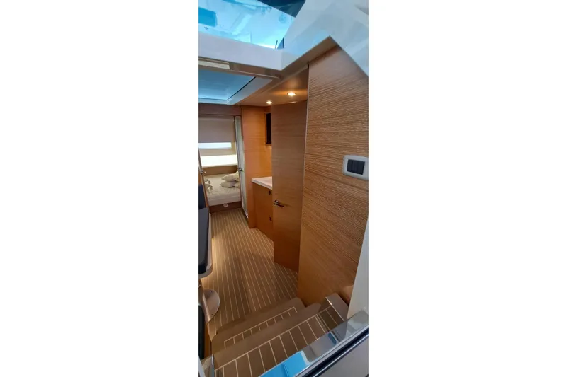  Yacht Photos Pics Interior view of 2022 Scout 530 LXF yacht, featuring modern wood paneling and sleek design.