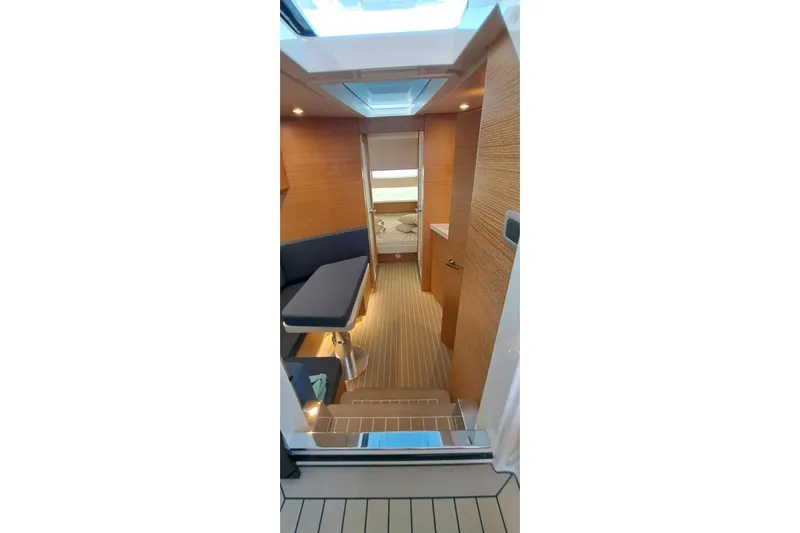  Yacht Photos Pics Interior of 2022 Scout 530 LXF yacht, featuring modern wood paneling and seating area.